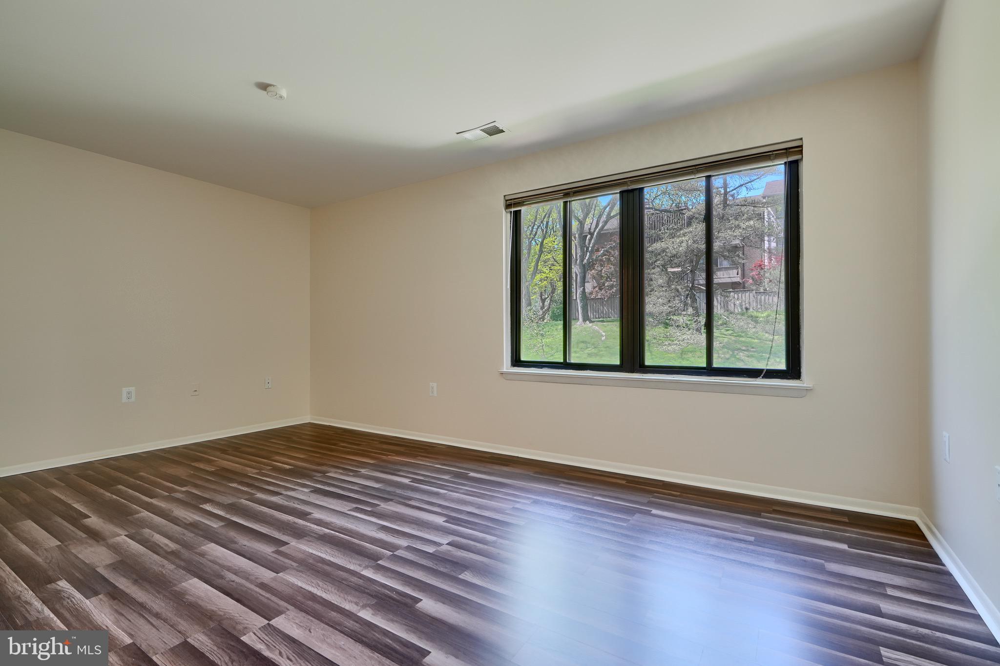 106 Cross Keys Road, Unit R106C Baltimore, MD 21210 - Photo 14 of 26 Primary Bedrm view of front beautifully landscaped