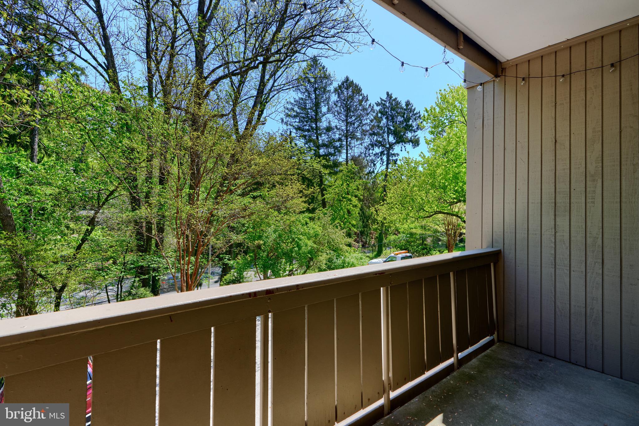 106 Cross Keys Road, Unit R106C Baltimore, MD 21210 - Photo 23 of 26 Deck off Dining Room overlooks overflow parking
