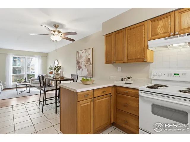 a kitchen with a stove a sink dishwasher and a refrigerator