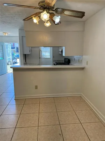 a kitchen with a cabinets appliances and a counter top space