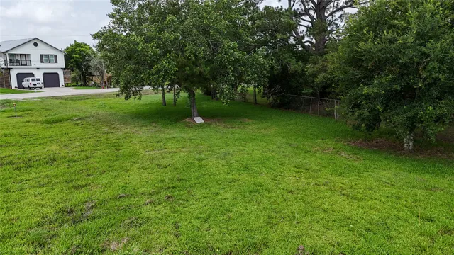 a view of an house with backyard space and garden