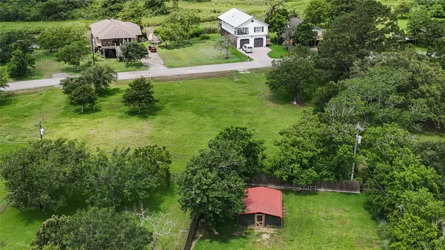 an aerial view of a house with pool yard outdoor seating and yard