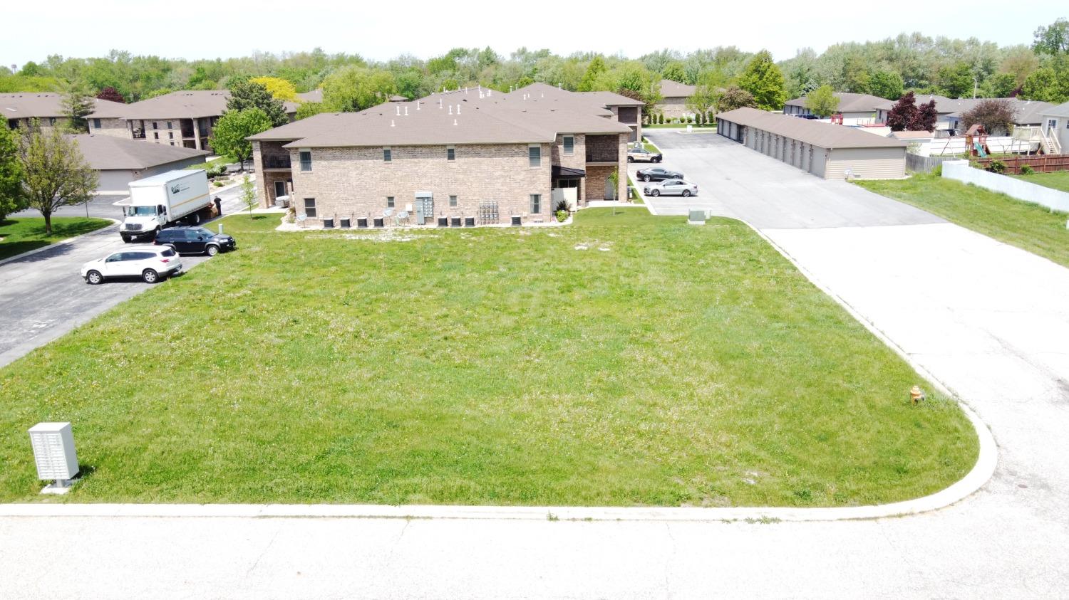 1321 Prairie Drive Crown Point, IN 46307 - Photo 2 of 5 a view of a house with a backyard porch and sitting area