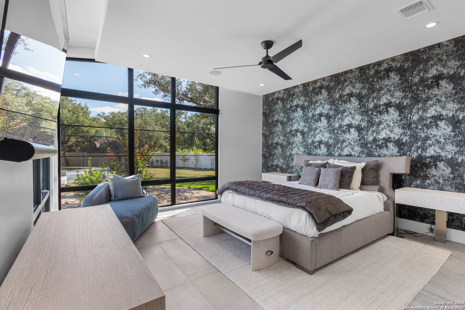 135 Whittingham Road San Antonio, TX 78231 - Photo 11 of 43 a spacious bedroom with a large bed and a large window