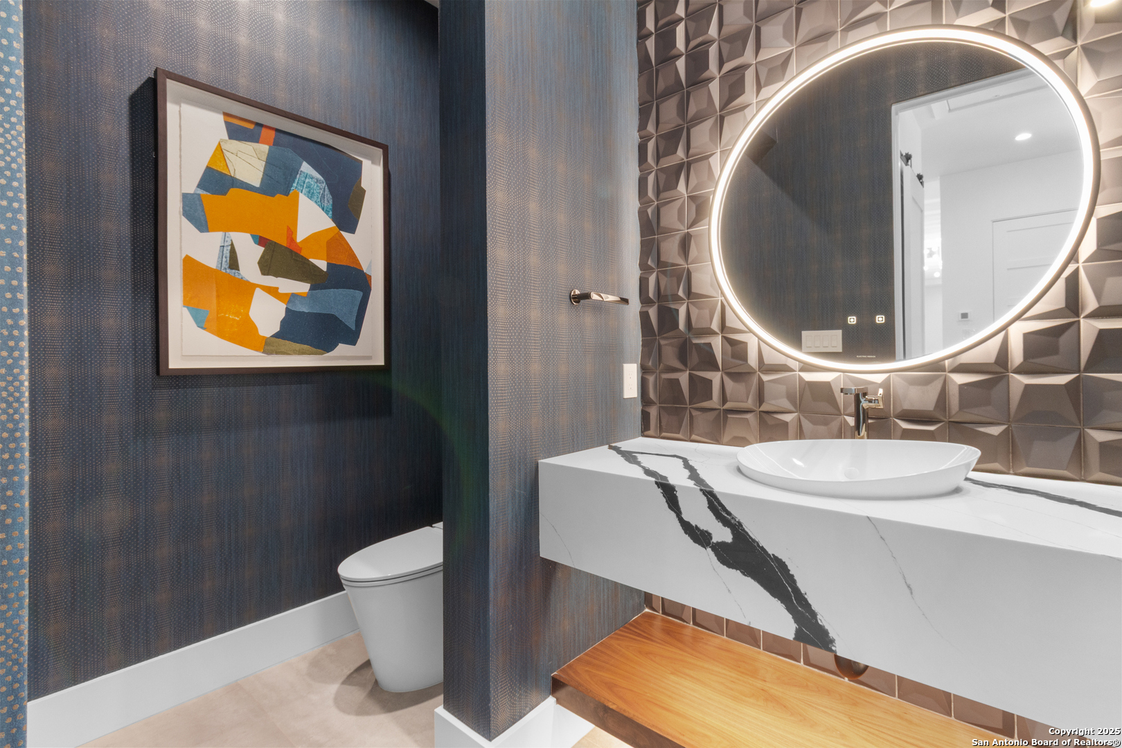 135 Whittingham Road San Antonio, TX 78231 - Photo 20 of 43 a bathroom with a sink and a mirror