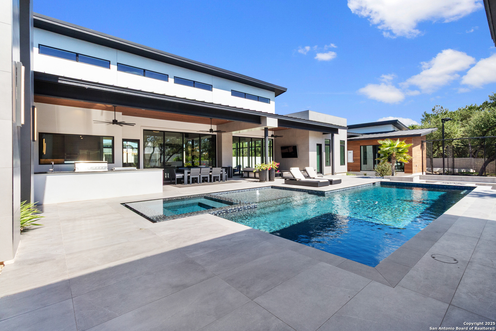 135 Whittingham Road San Antonio, TX 78231 - Photo 34 of 43 a view of a patio with swimming pool and table and chairs