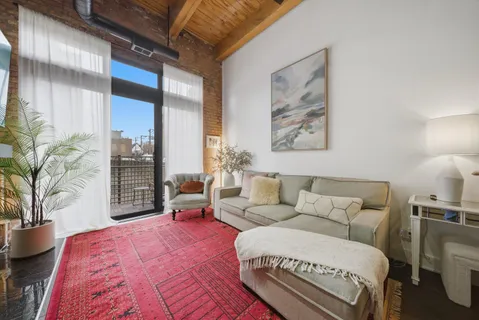 a bedroom with a large bed and a couch