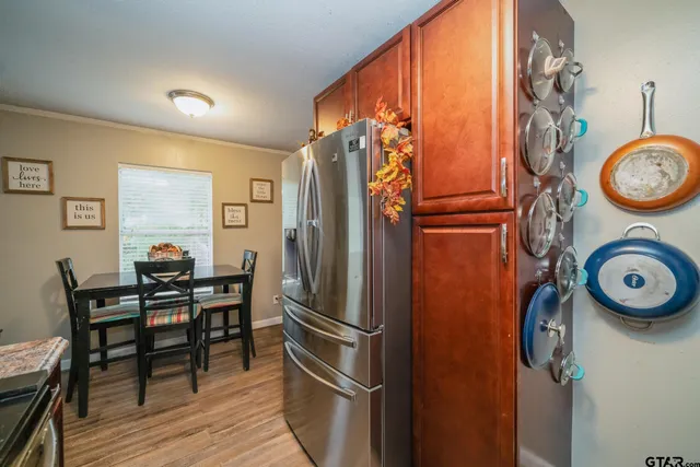 a view of a dining area with furniture kitchen and wooden floor