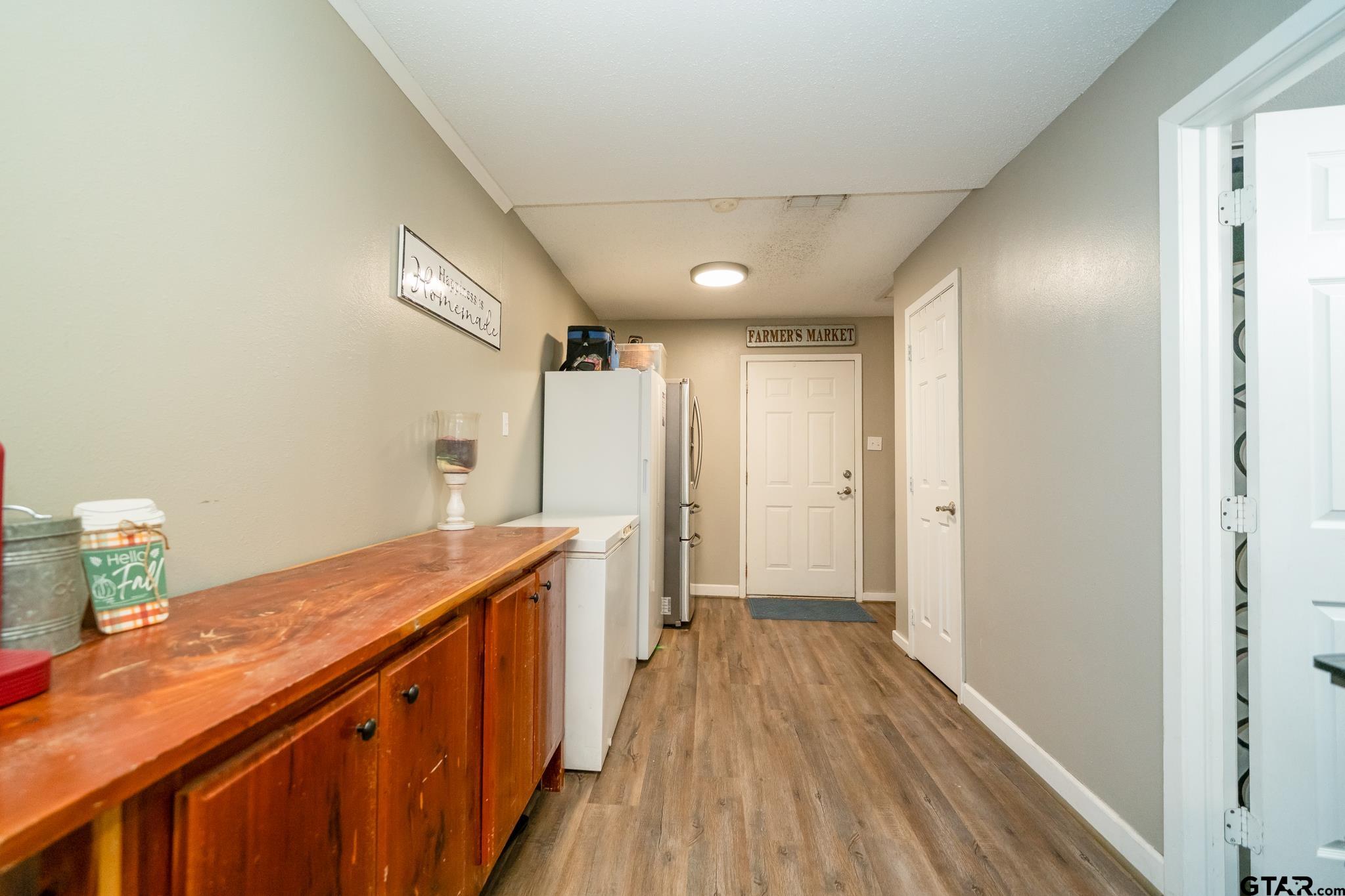 208 East Center Street White Oak, TX 75693 - Photo 26 of 31 a view of a hallway with wooden floor