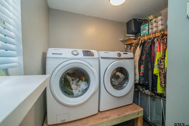 a utility room with dryer and washer