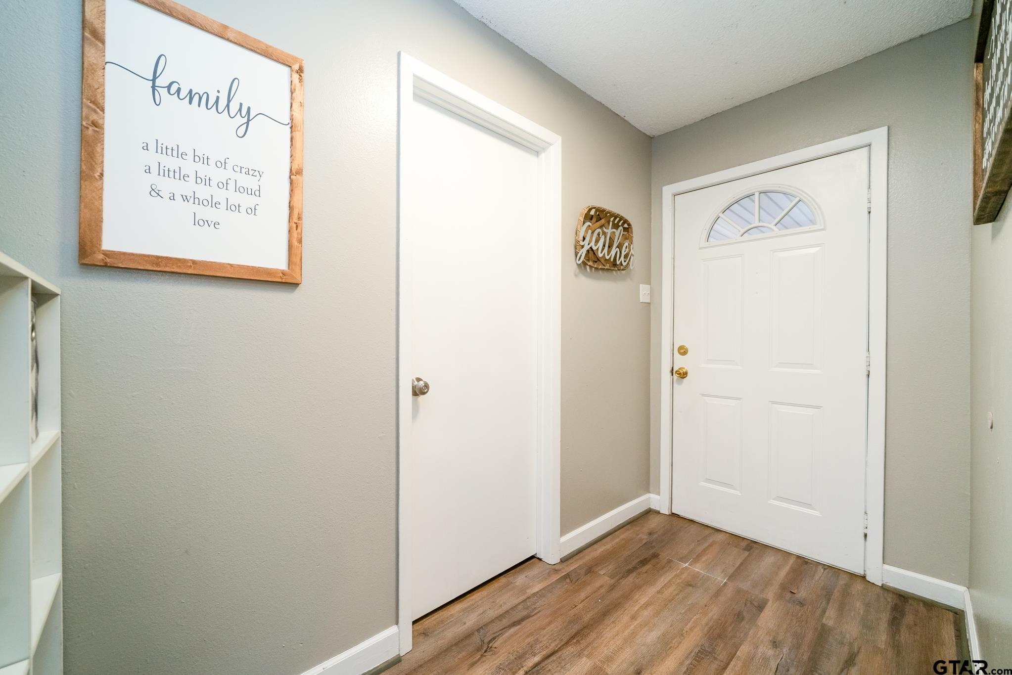 208 East Center Street White Oak, TX 75693 - Photo 7 of 31 a view of a hallway with wooden floor