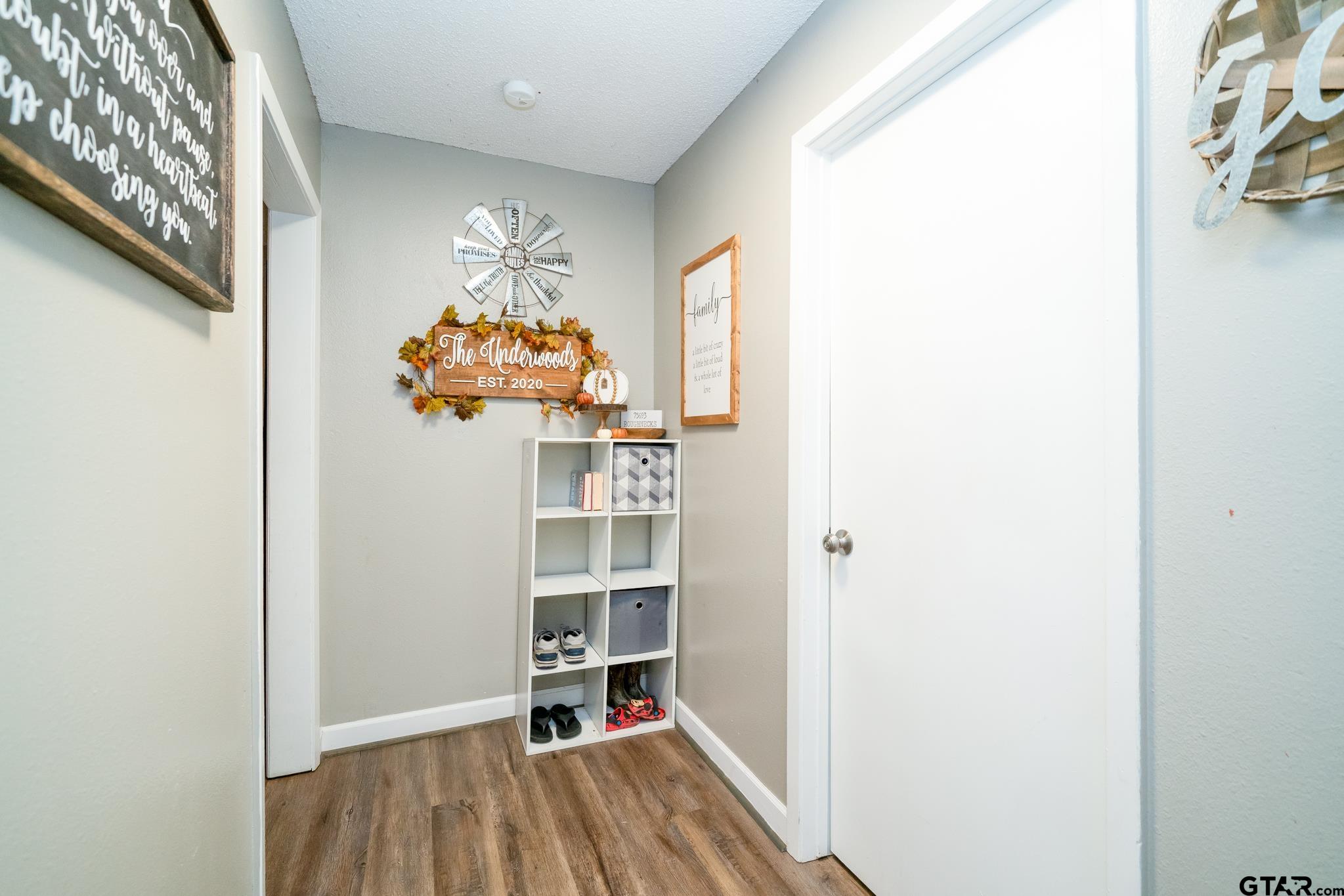 208 East Center Street White Oak, TX 75693 - Photo 8 of 31 a view of a room with wooden floor and a window