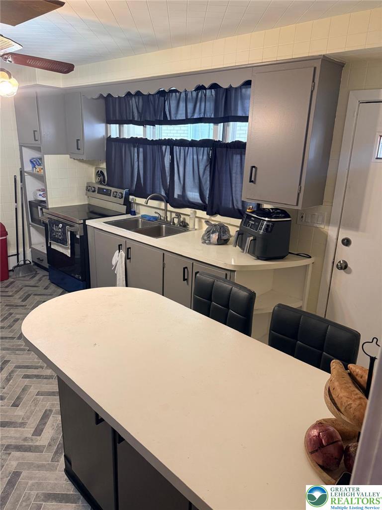 617 South 5th Street Allentown, PA 18103 - Photo 6 of 19 a kitchen with a sink and a refrigerator