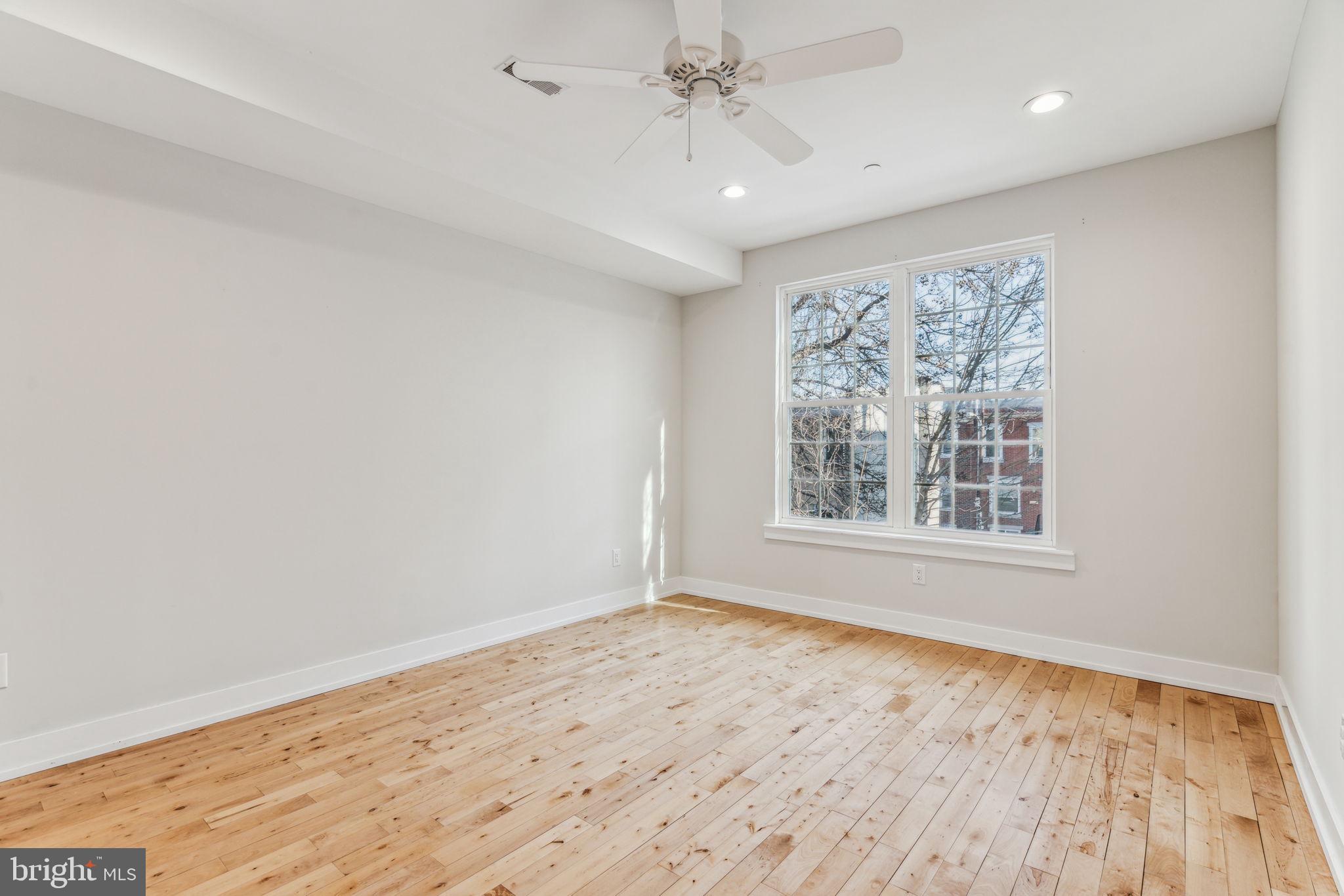 1335 North 30th Street Philadelphia, PA 19121 - Photo 20 of 58 wooden floor in an empty room with a window