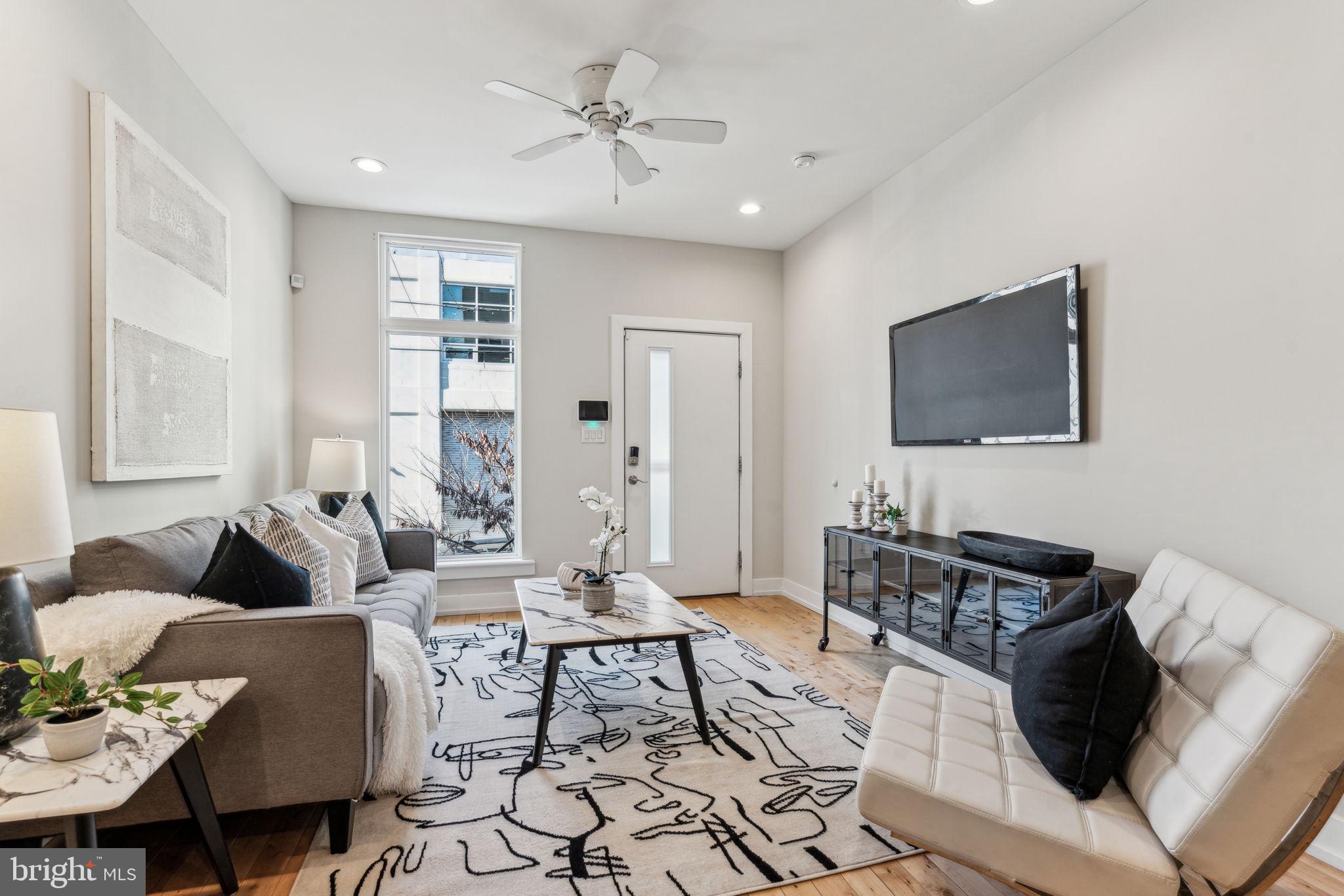 1335 North 30th Street Philadelphia, PA 19121 - Photo 2 of 58 a living room with furniture and a flat screen tv