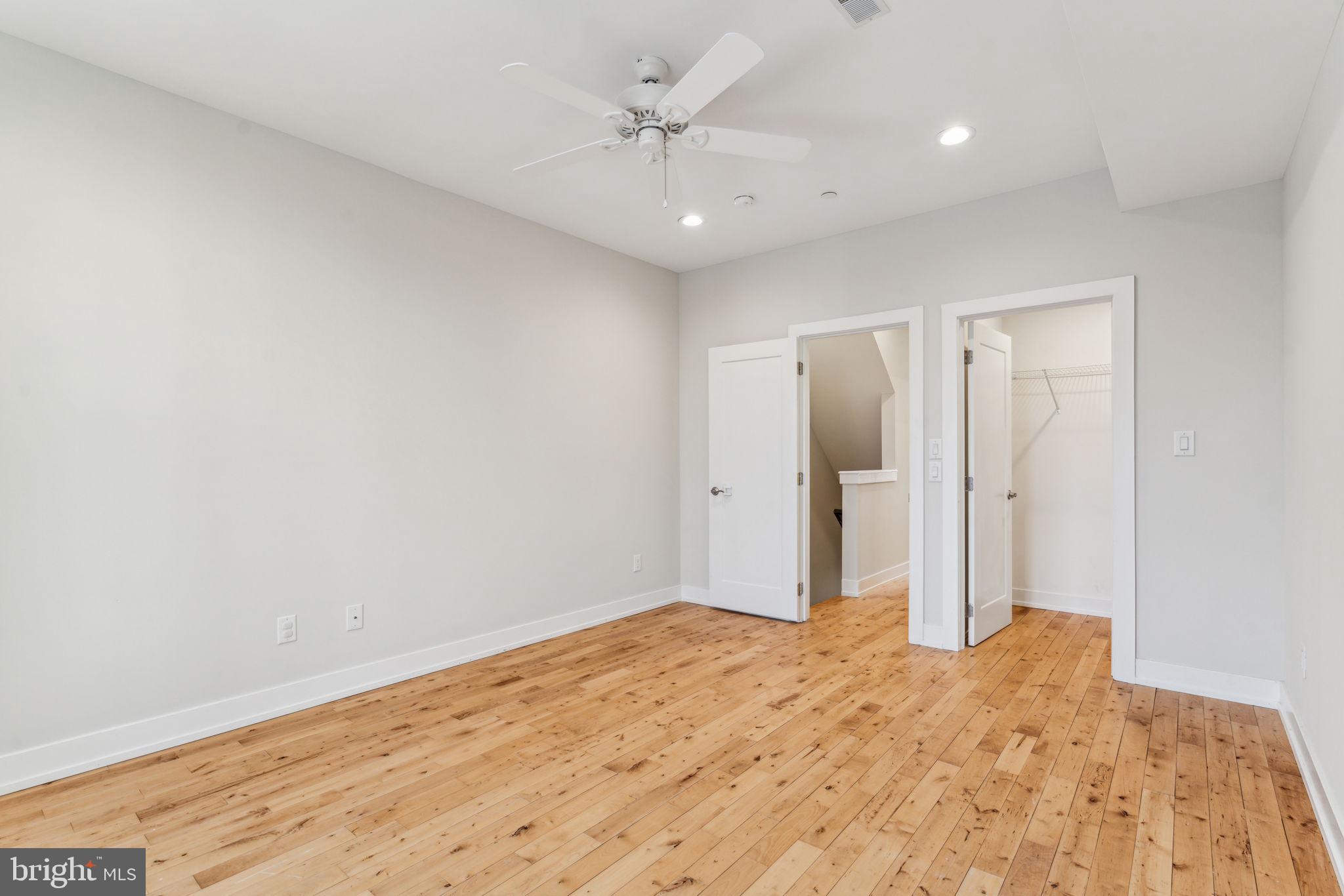 1335 North 30th Street Philadelphia, PA 19121 - Photo 22 of 58 a view of a big room with wooden floor and a chandelier fan