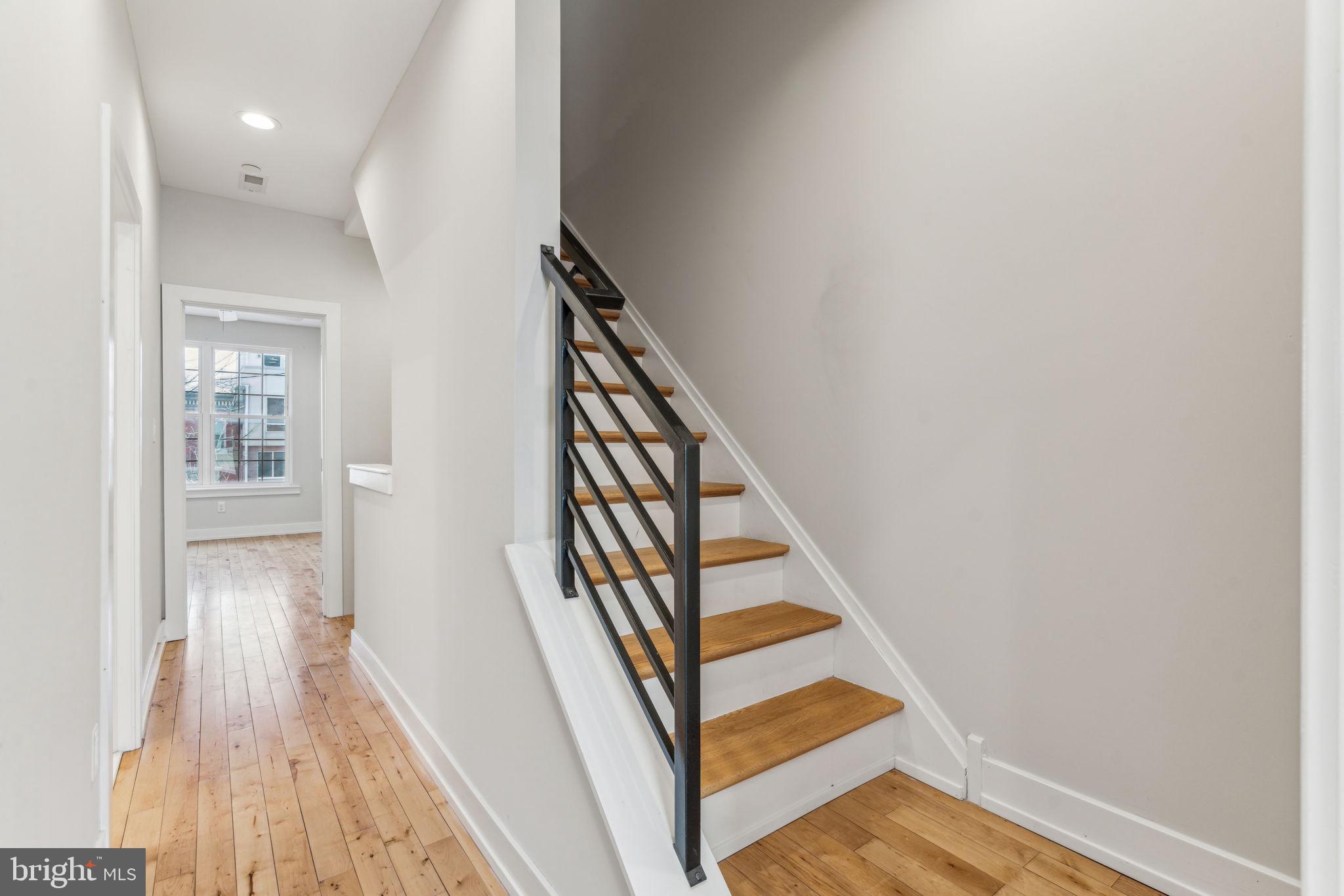 1335 North 30th Street Philadelphia, PA 19121 - Photo 27 of 58 a view of a hallway with wooden floor and staircase