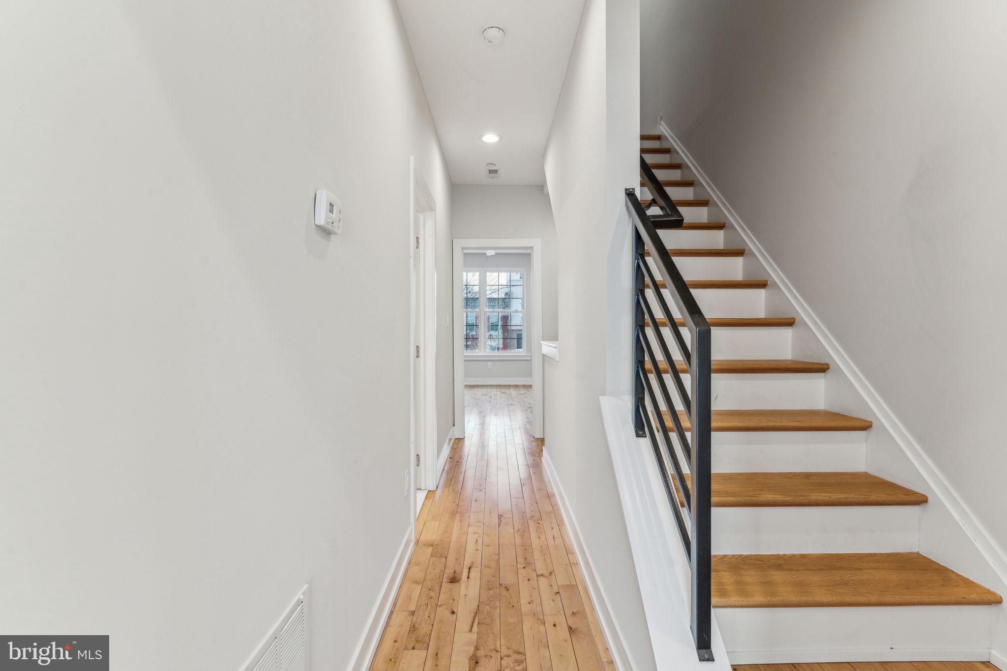 1335 North 30th Street Philadelphia, PA 19121 - Photo 28 of 58 a view of a hallway with wooden floor and entryway