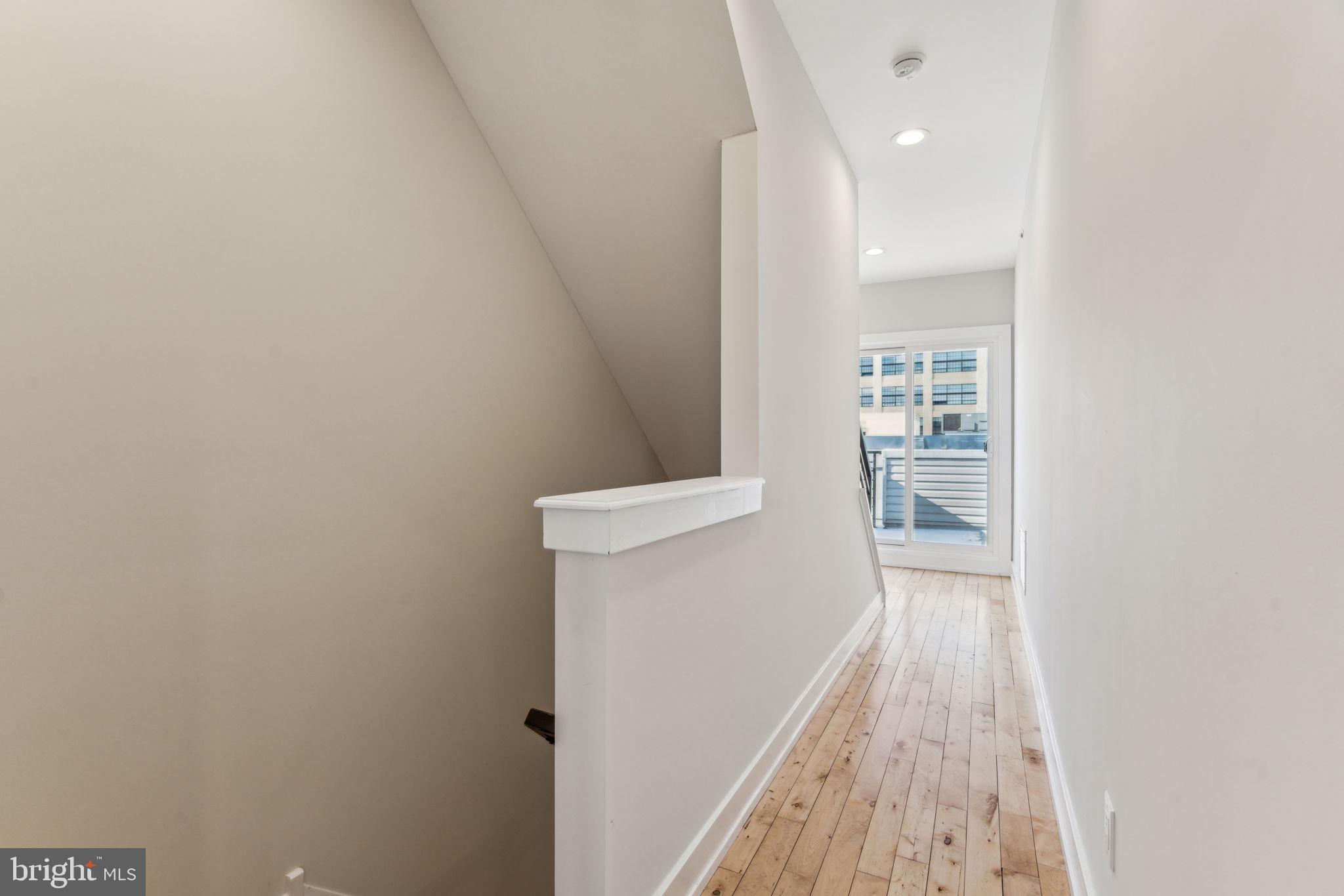 1335 North 30th Street Philadelphia, PA 19121 - Photo 33 of 58 a view of hallway with wooden floor