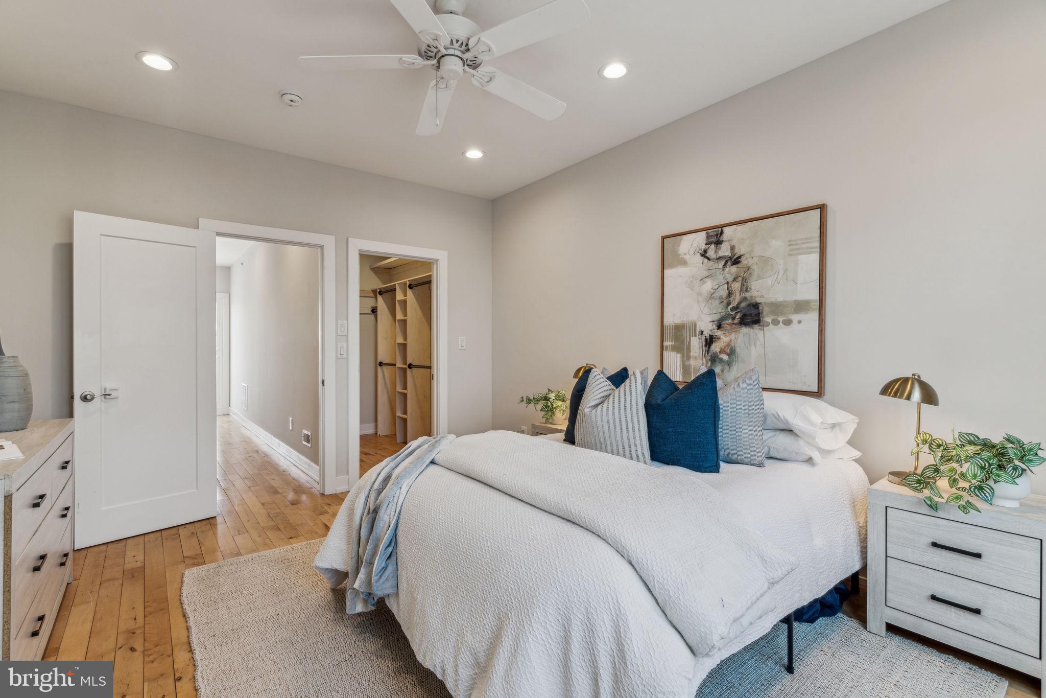 1335 North 30th Street Philadelphia, PA 19121 - Photo 37 of 58 a bedroom with a bed and a chandelier