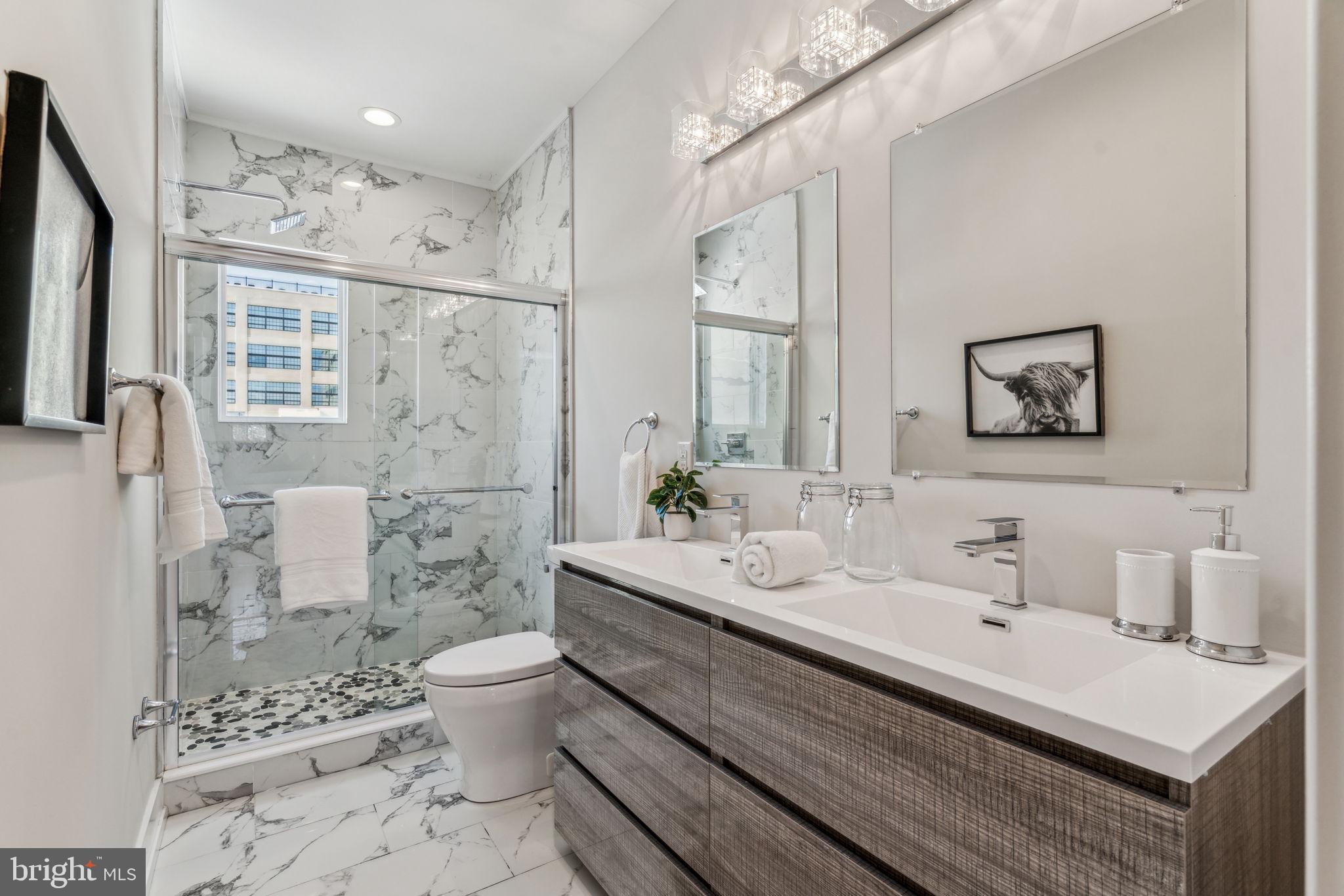 1335 North 30th Street Philadelphia, PA 19121 - Photo 40 of 58 a bathroom with a sink a toilet and shower