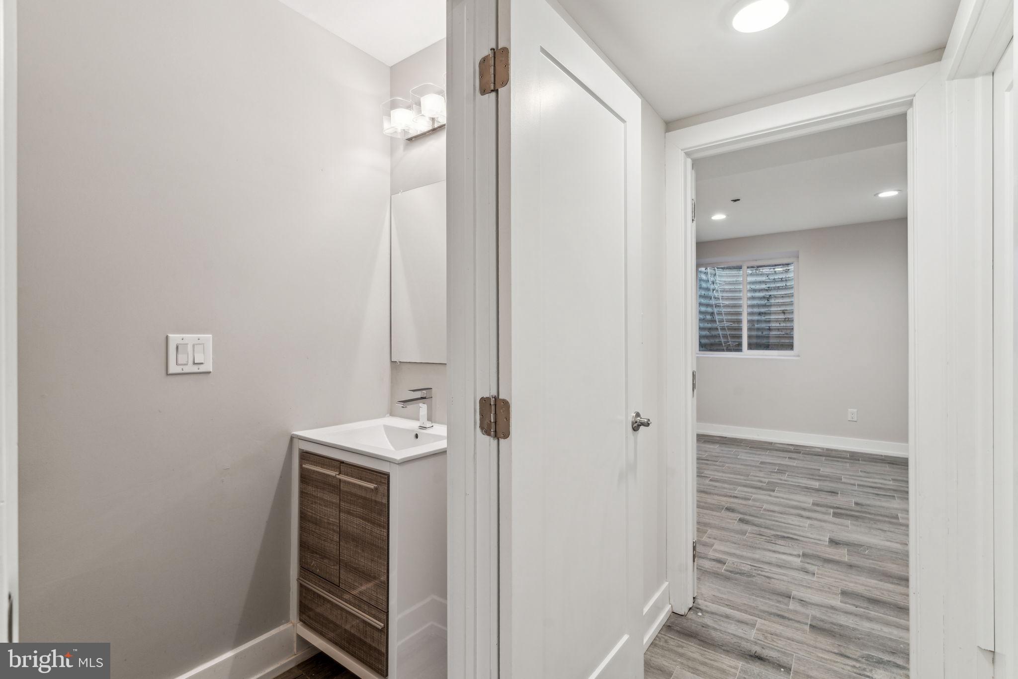 1335 North 30th Street Philadelphia, PA 19121 - Photo 49 of 58 a bathroom with a sink a toilet and shower