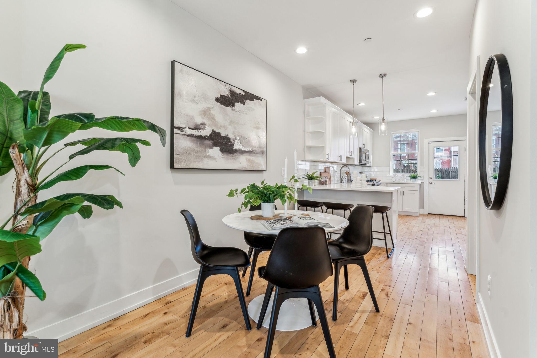 1335 North 30th Street Philadelphia, PA 19121 - Photo 5 of 58 a dining room with furniture and a kitchen view