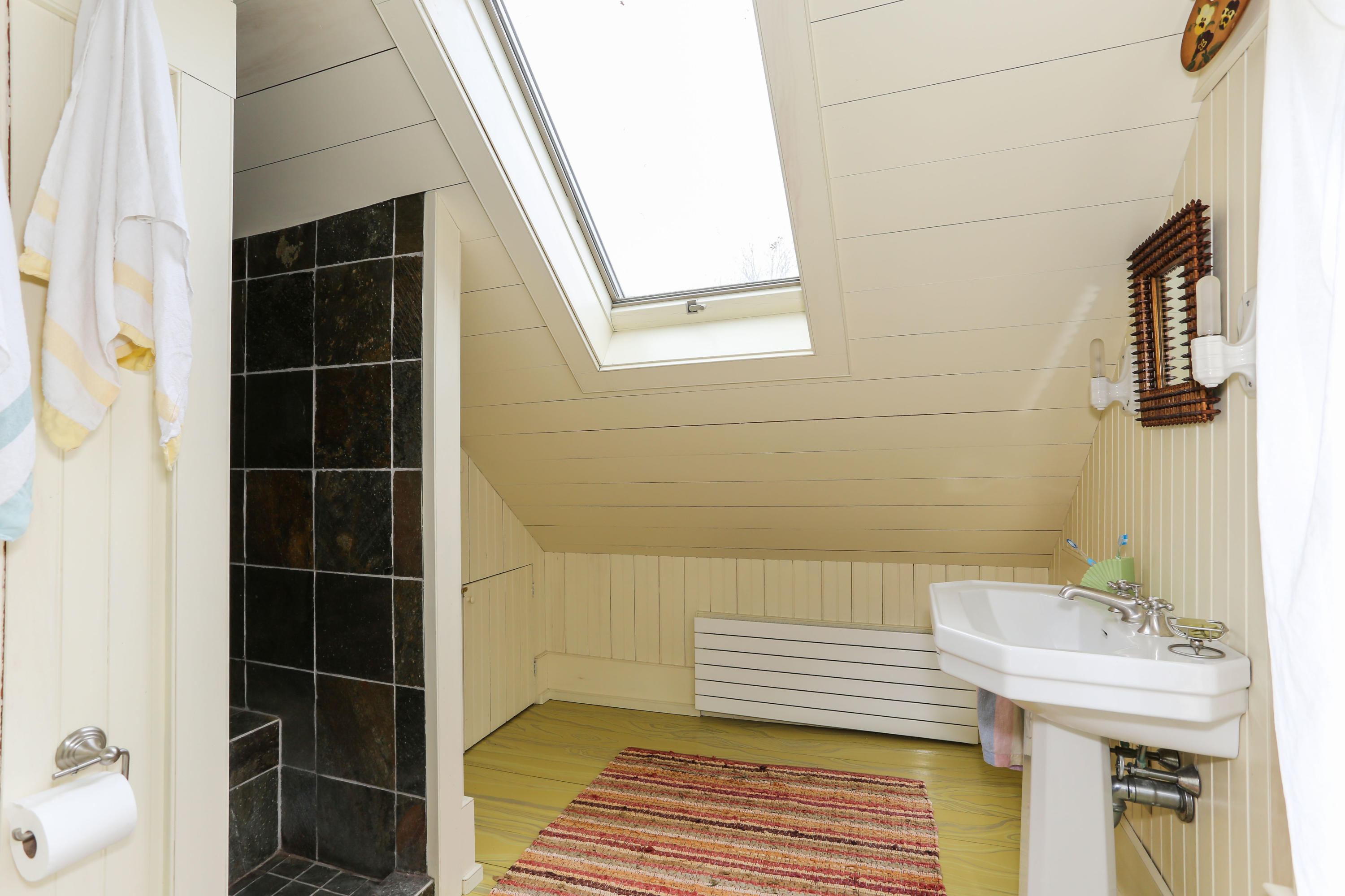 11-15 Franklin Street Provincetown, MA 02657 - Photo 15 of 26 a bathroom with a sink and a mirror
