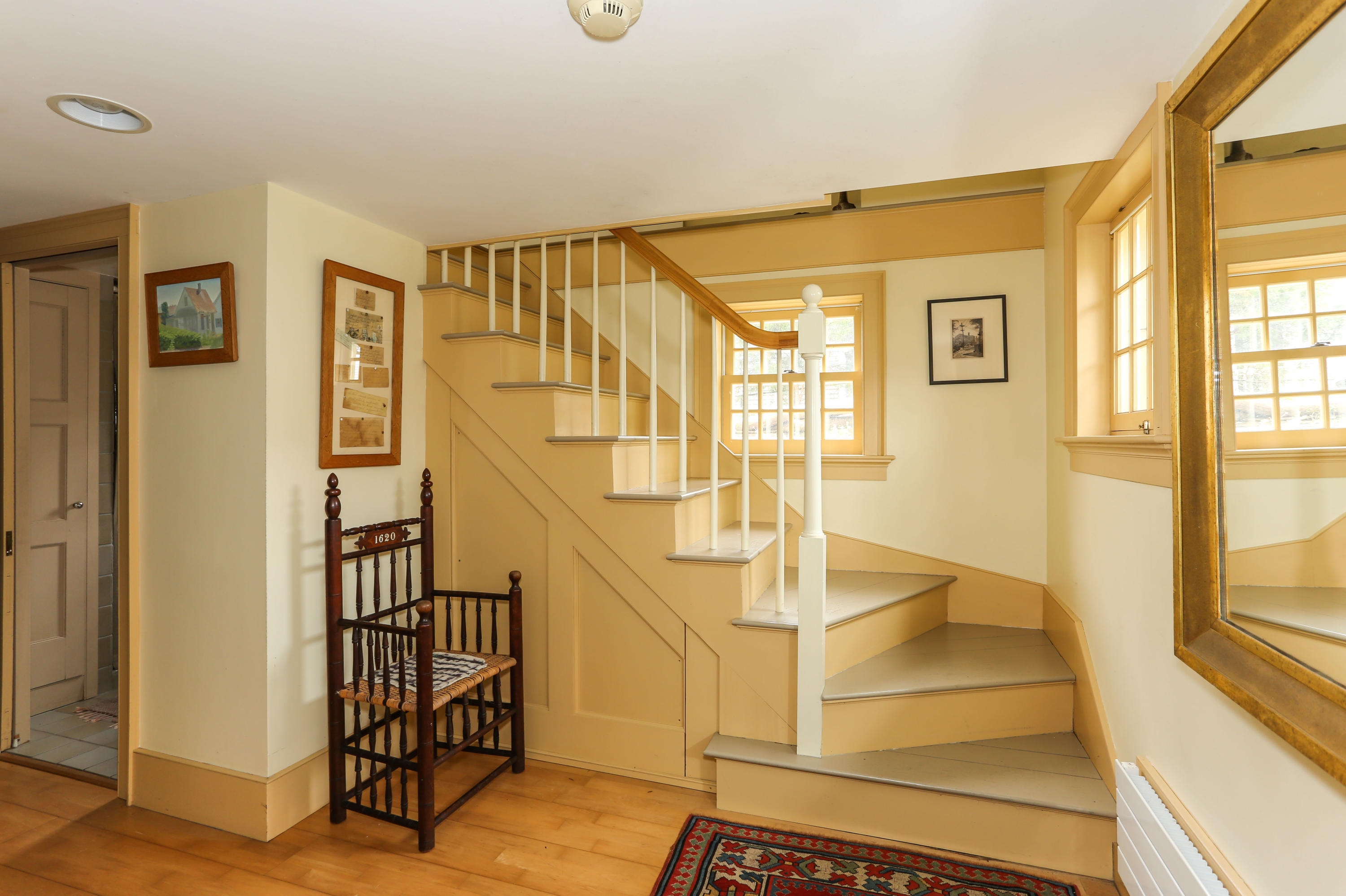 11-15 Franklin Street Provincetown, MA 02657 - Photo 16 of 26 a view of an entryway with wooden floor and door
