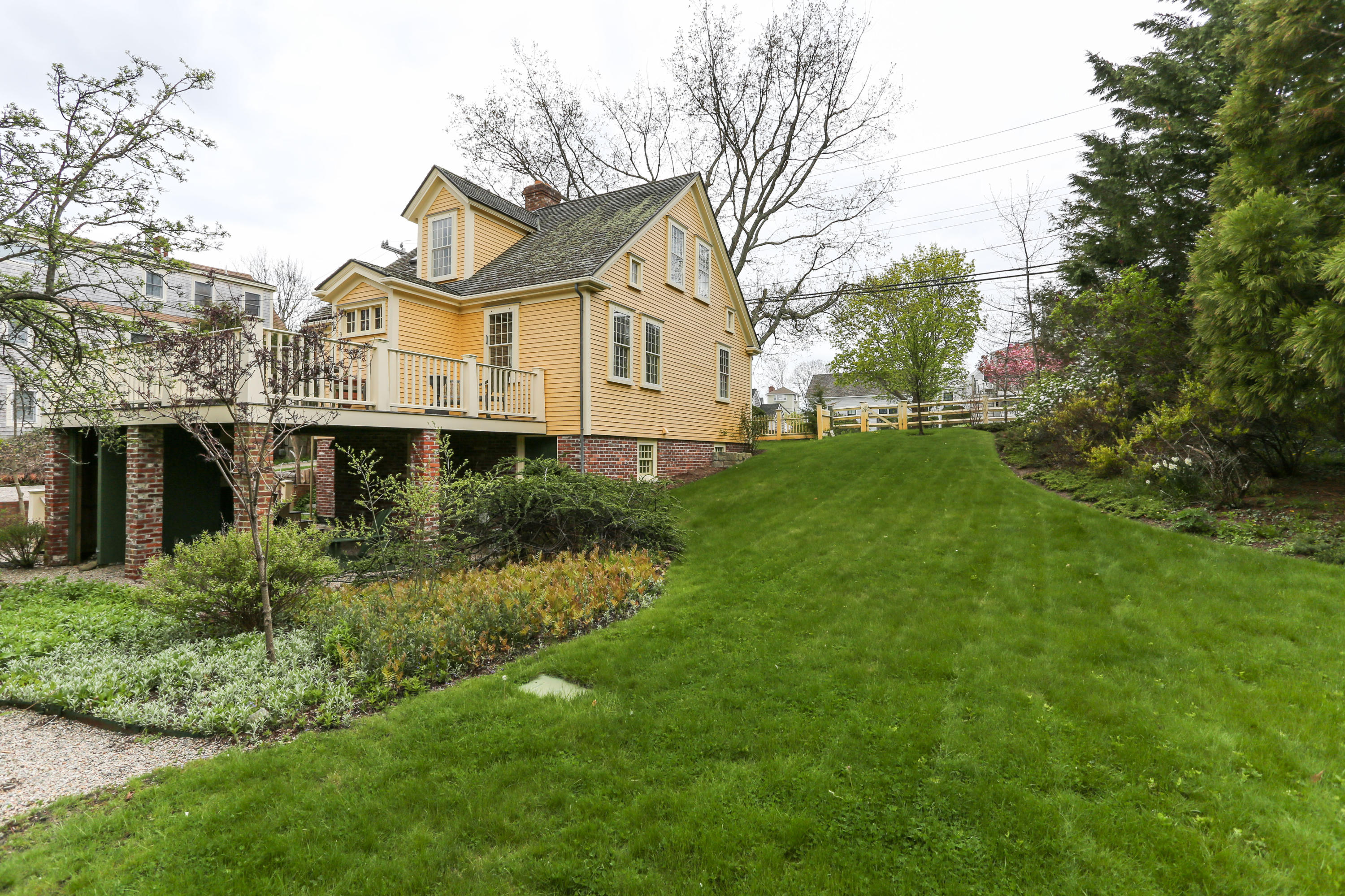 11-15 Franklin Street Provincetown, MA 02657 - Photo 21 of 26 a aerial view of a house with a big yard and large trees