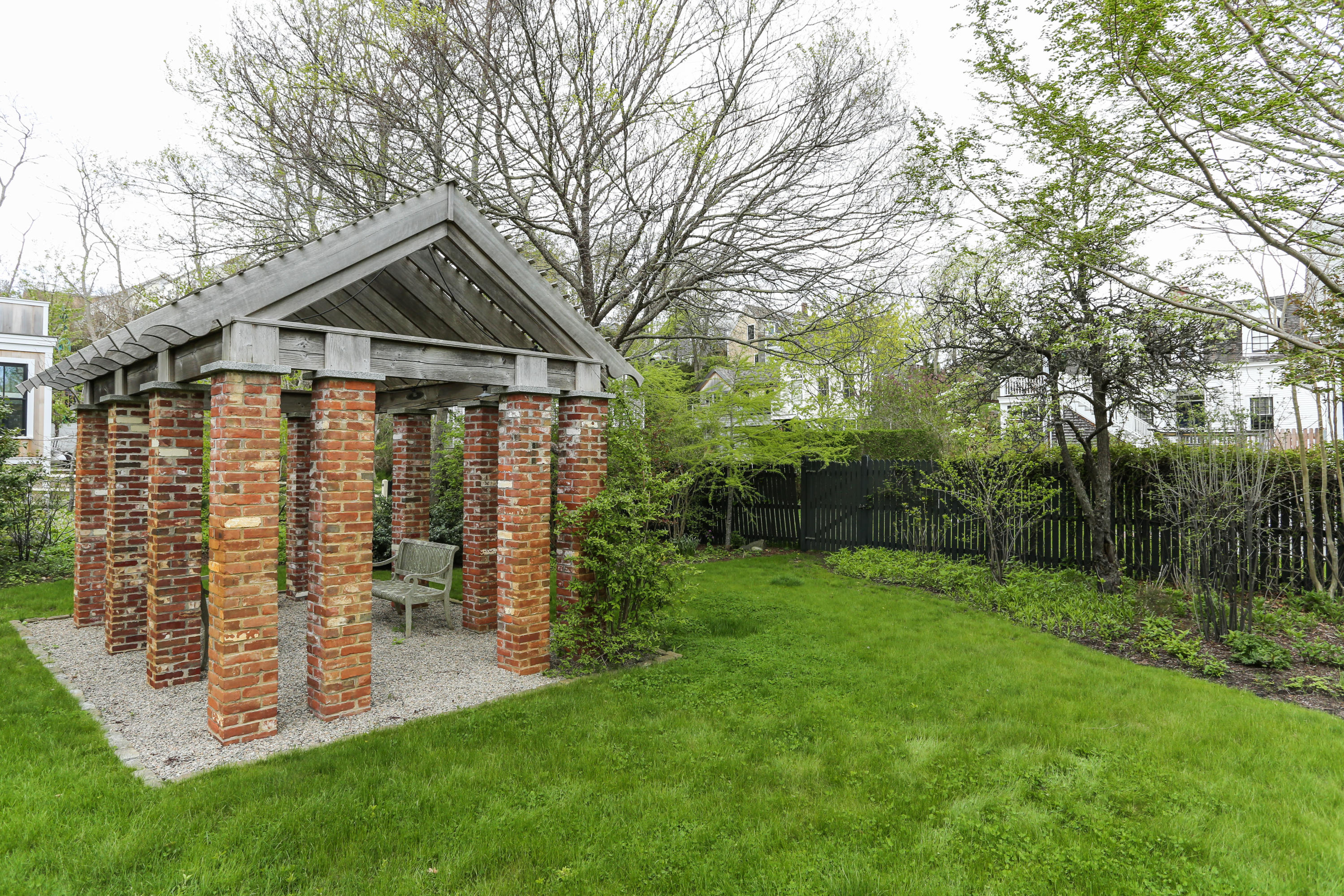 11-15 Franklin Street Provincetown, MA 02657 - Photo 22 of 26 a front view of a house with garden