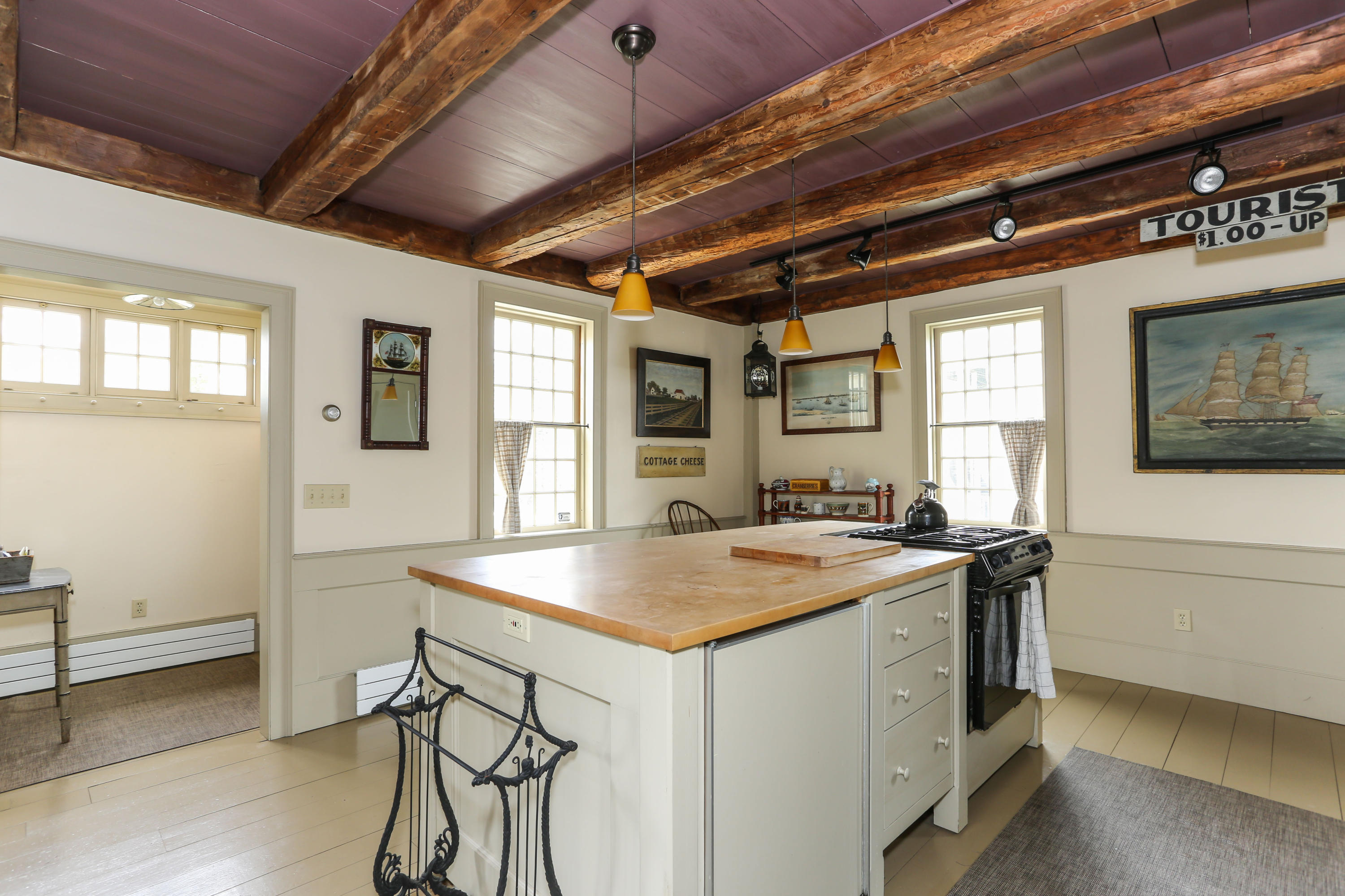11-15 Franklin Street Provincetown, MA 02657 - Photo 6 of 26 a room with a table chairs and wooden floor