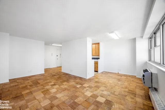 a view of an empty room with a window