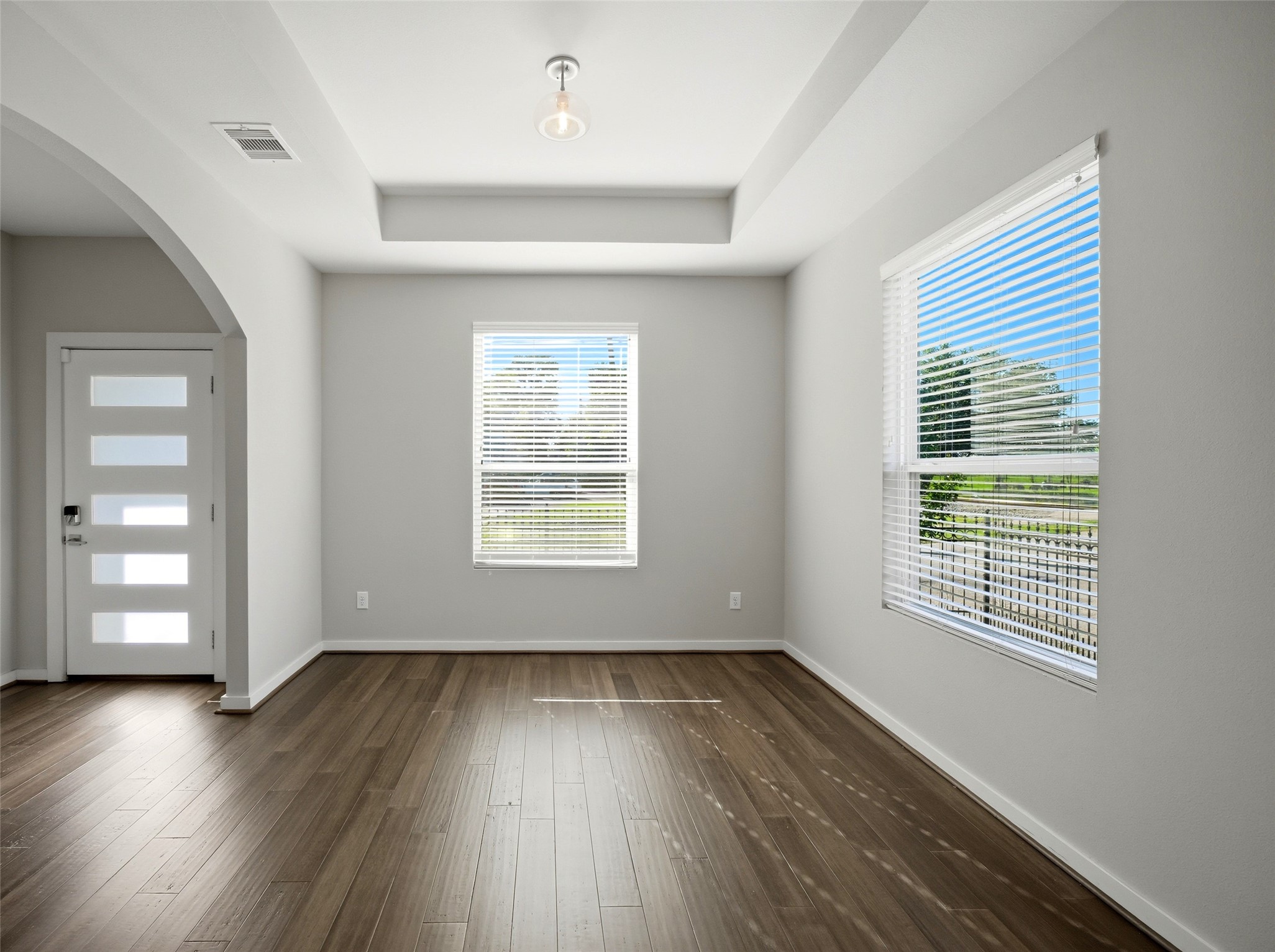 605 Dumble Street Houston, TX 77023 - Photo 10 of 44 wooden floor in an empty room with a window