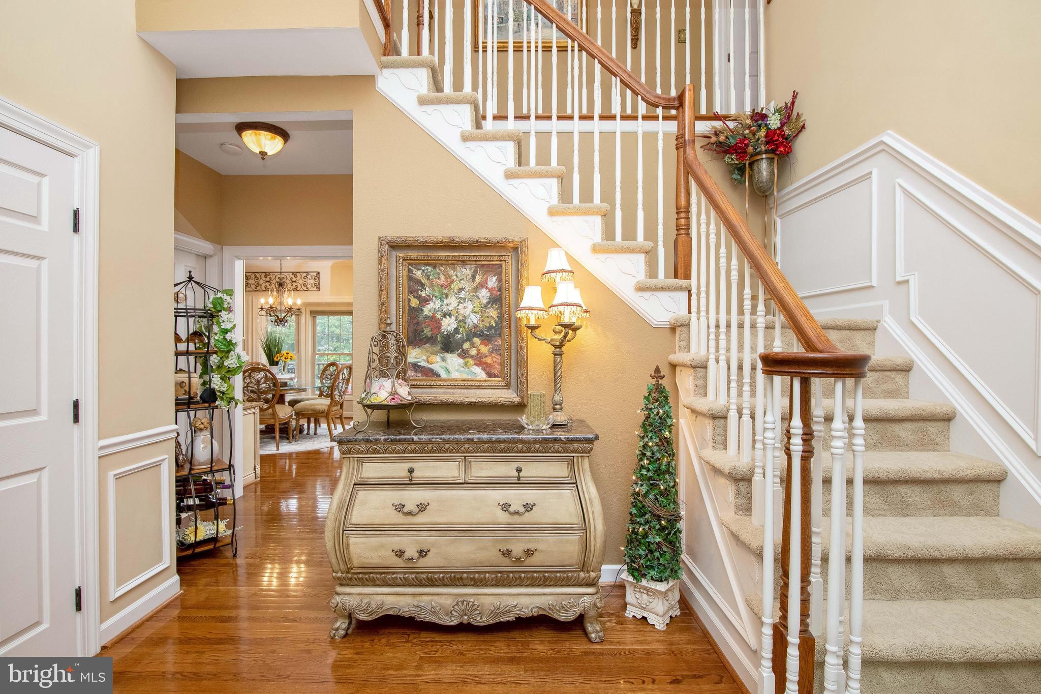 40 Covington Lane Voorhees, NJ 08043 - Photo 3 of 57 2 story foyer with crown molding and wainscoting