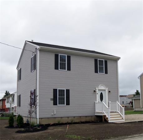 8 Reeves Street Fall River, MA 02721 - Photo 13 of 13 a front view of a house with garage