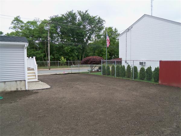 8 Reeves Street Fall River, MA 02721 - Photo 3 of 13 a view of a backyard with sitting area