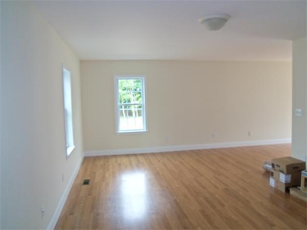8 Reeves Street Fall River, MA 02721 - Photo 7 of 13 an empty room with wooden floor and a window