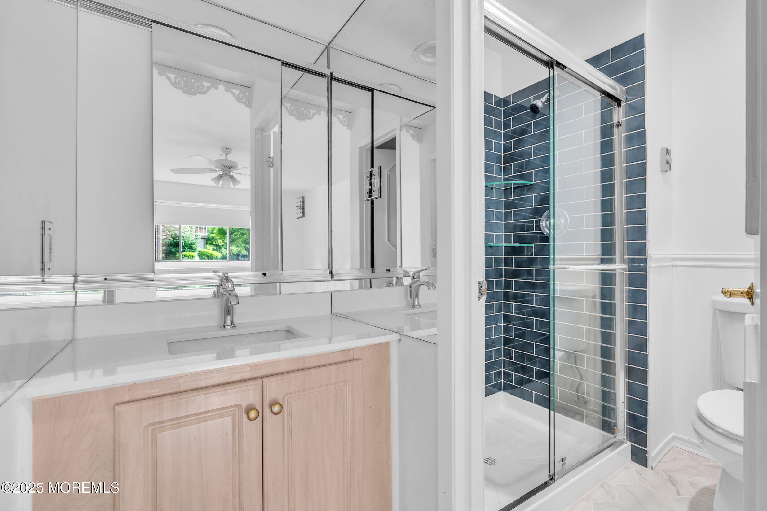 70 Overlook Way, Unit A Manalapan, NJ 07726 - Photo 11 of 20 a bathroom with a shower sink vanity mirror and toilet