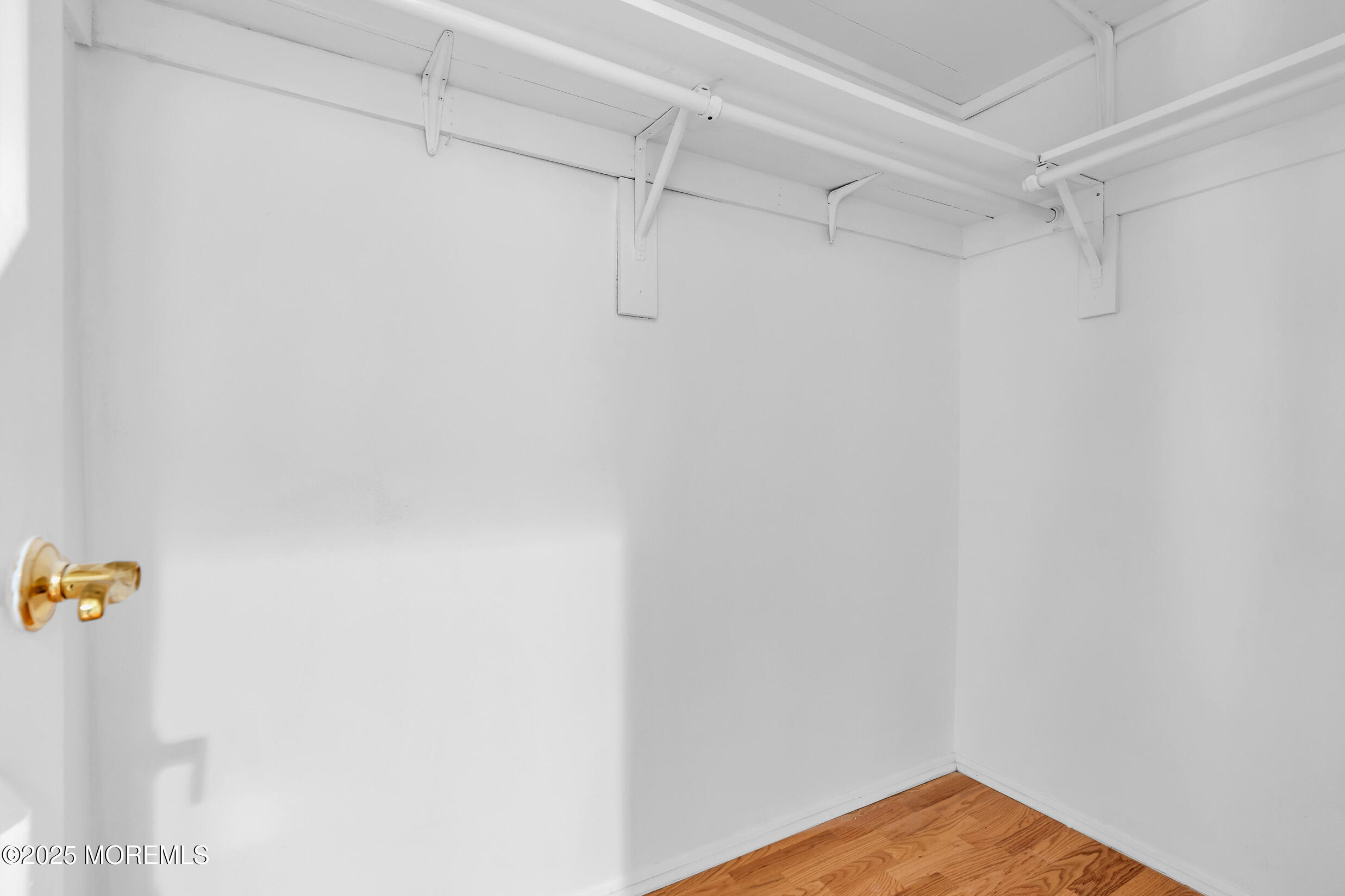 70 Overlook Way, Unit A Manalapan, NJ 07726 - Photo 12 of 20 a view of a room with racks on the wall