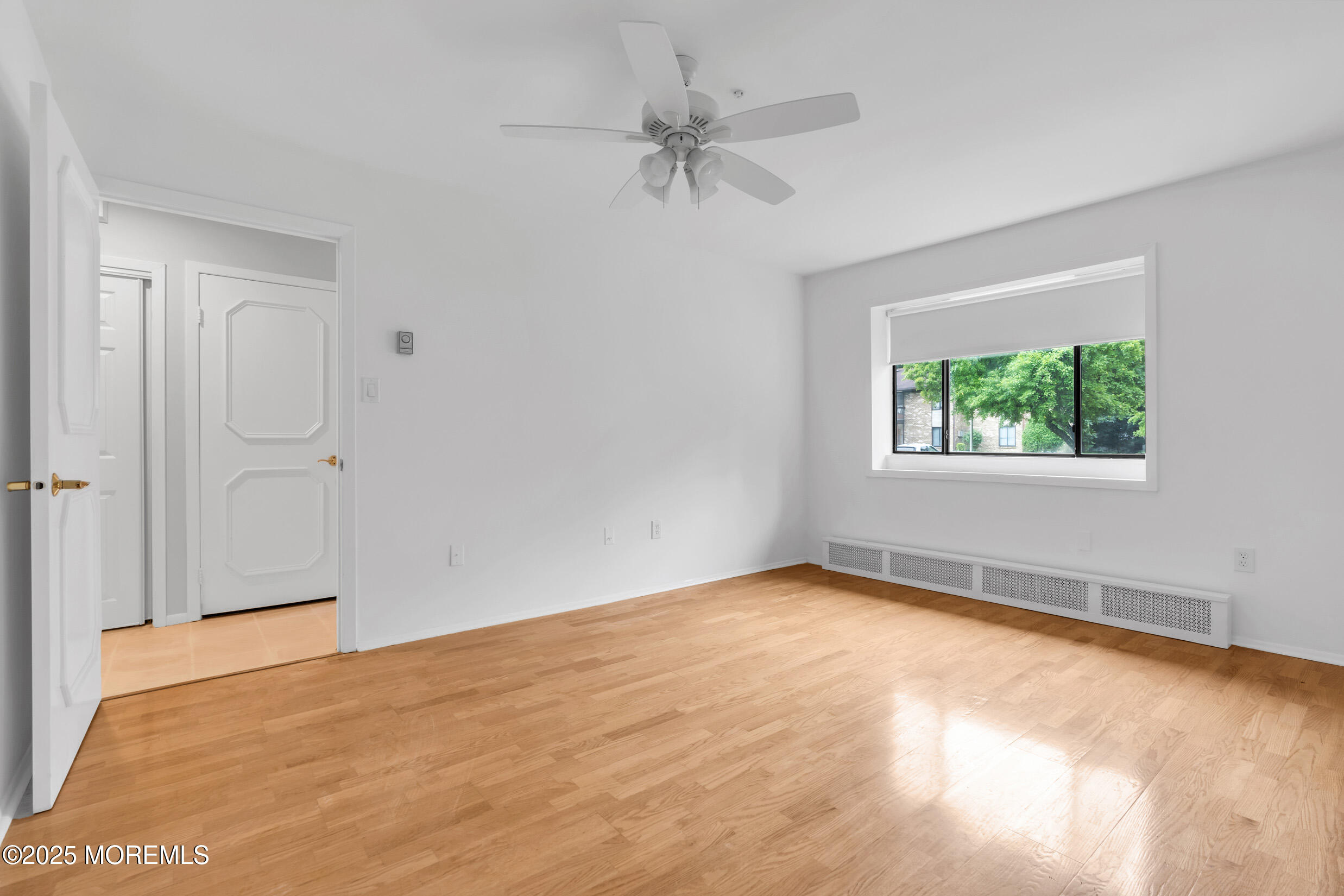 70 Overlook Way, Unit A Manalapan, NJ 07726 - Photo 10 of 20 a view of an empty room with a window