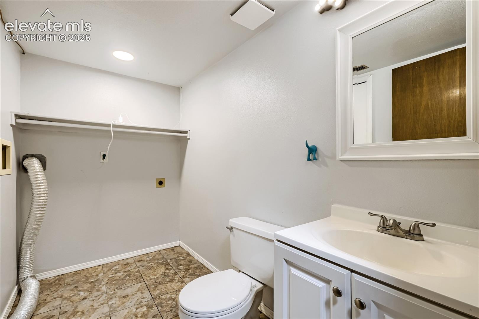 6375 Bismark Road Colorado Springs, CO 80922 - Photo 14 of 26 Lower Level Laundry and Half Bath