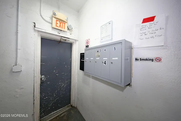 a bathroom with a shower and a sink