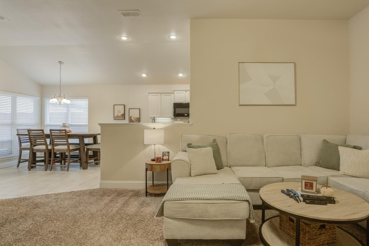 3605 Ridgely Lubbock, TX 79407 - Photo 11 of 36 a living room with furniture and a table