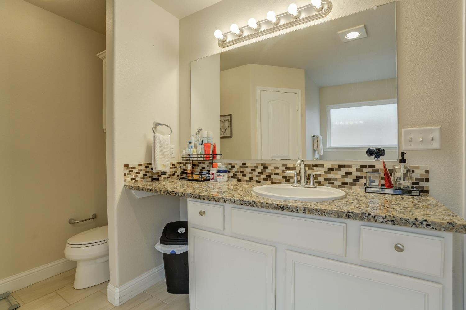 3605 Ridgely Lubbock, TX 79407 - Photo 26 of 36 a bathroom with a sink and a toilet
