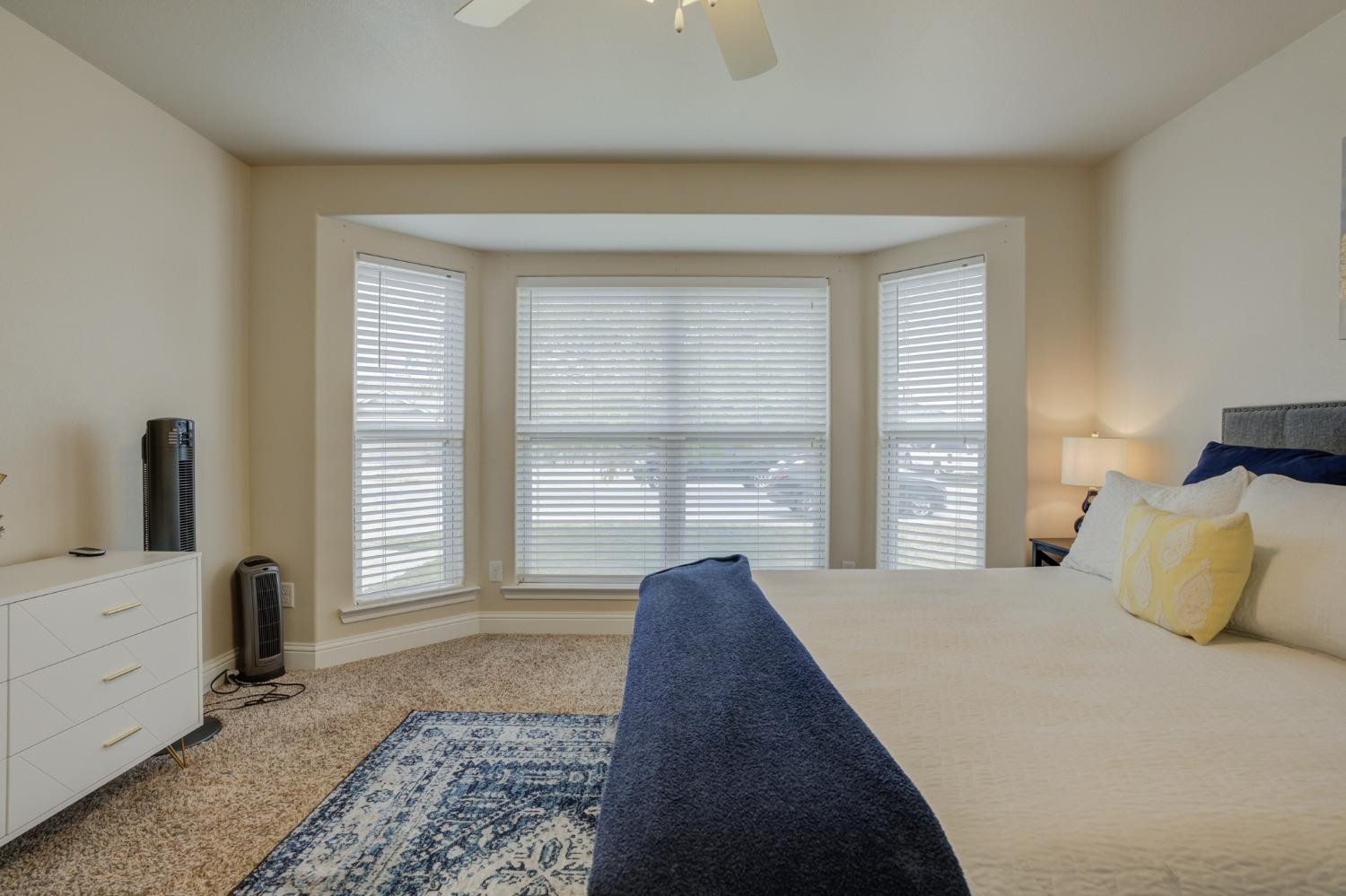 3605 Ridgely Lubbock, TX 79407 - Photo 28 of 36 a bedroom with a bed and glass door