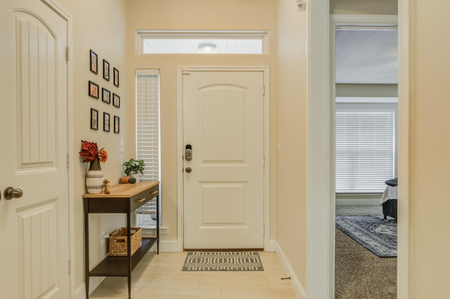 3605 Ridgely Lubbock, TX 79407 - Photo 5 of 36 a view of a hallway to a livingroom with furniture and front door