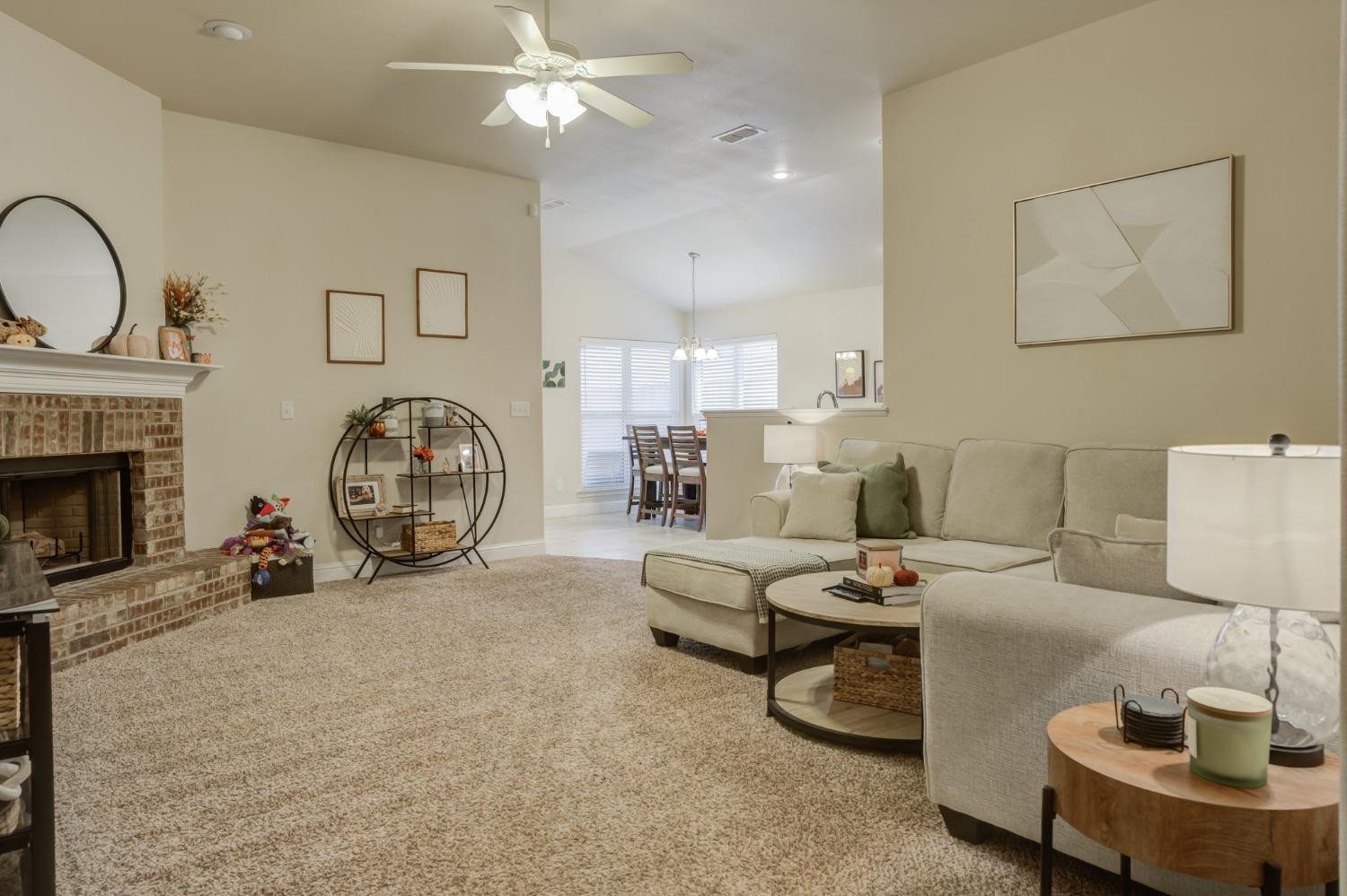 3605 Ridgely Lubbock, TX 79407 - Photo 6 of 36 a living room with furniture a fireplace and a flat screen tv