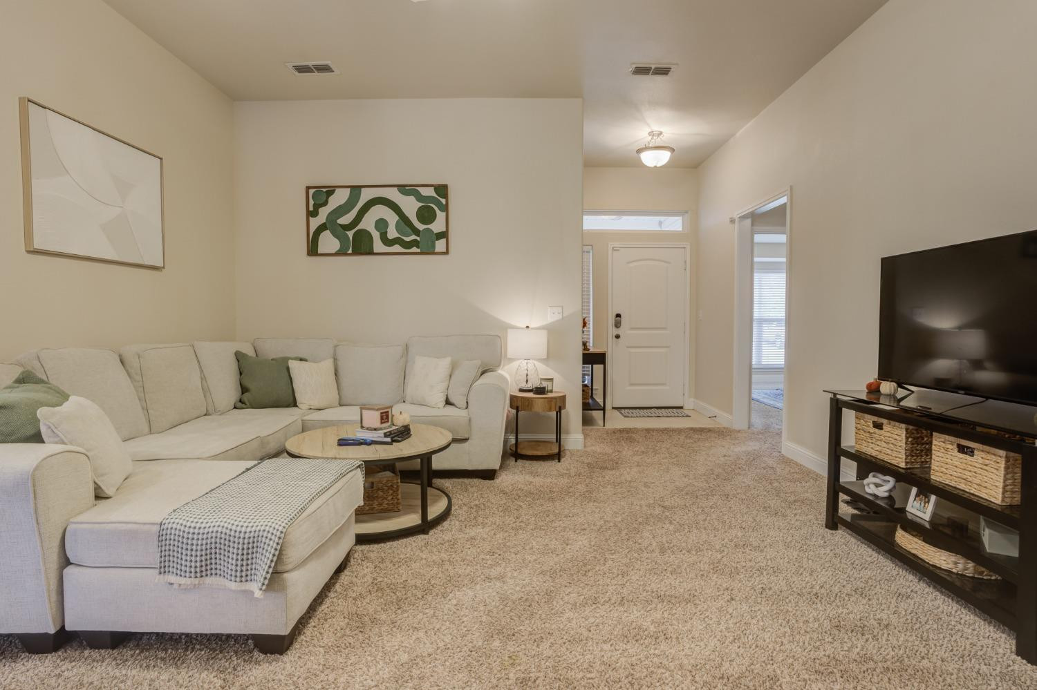 3605 Ridgely Lubbock, TX 79407 - Photo 9 of 36 a living room with furniture and a flat screen tv