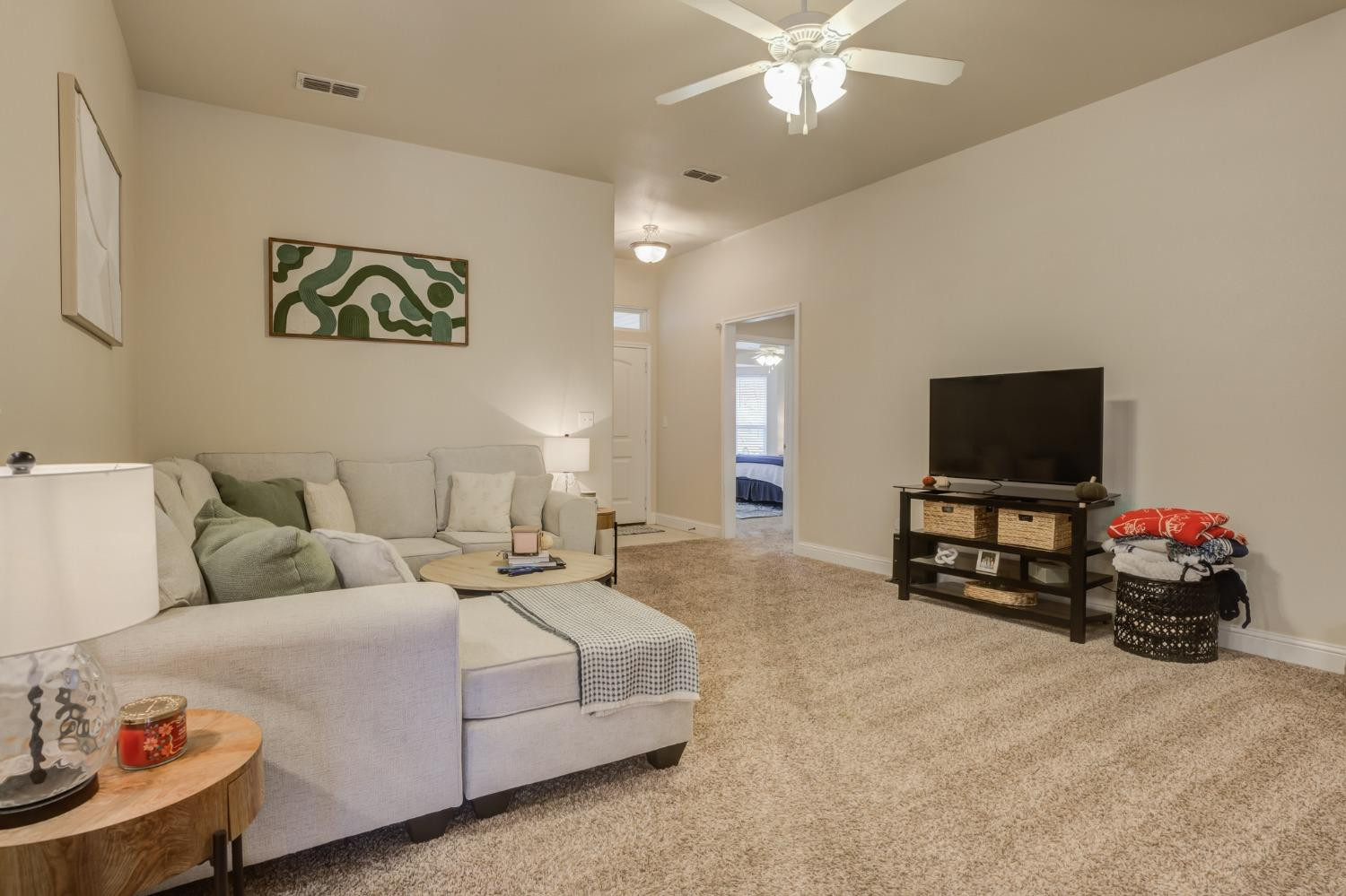 3605 Ridgely Lubbock, TX 79407 - Photo 10 of 36 a living room with furniture and a flat screen tv